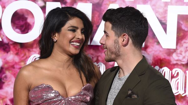 Cast member Priyanka Chopra and her husband, Nick Jonas, arrive at the Los Angeles premiere of Isn't It Romantic at The Theatre at Ace Hotel on Monday, Feb. 11, 2019 - Sputnik International