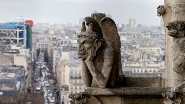 The Stryga, the most famous chimera of Notre Dame Cathedral, overlooks the French capital, in Paris, France, January 14, 2016 - Sputnik International