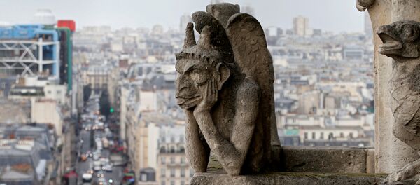 The Stryga, the most famous chimera of Notre Dame Cathedral, overlooks the French capital, in Paris, France, January 14, 2016 - Sputnik International