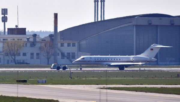A Global 5000 jet of the government is towed over a taxiway at Schoenefeld Airport in Berlin, on April 16, 2019. After a malfunction shortly after take-off, the aircraft was reversed and landed at Berlin-Schönefeld Airport with major problems - Sputnik International