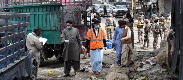 Pakistani security officials inspect the site of a bomb blast at a fruit market in Quetta on April 12, 2019 Pakistani security officials inspect the site of a bomb blast at a fruit market in Quetta on April 12, 2019 - Sputnik International