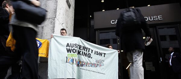 People protesting about the UK government's austerity programme, of which universal credit is the flagship People protesting about the UK government's austerity programme, of which universal credit is the flagship - Sputnik International