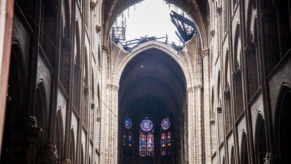 A view of the damaged roof of Notre-Dame de Paris in the aftermath of a fire that devastated the cathedral during the visit of French Interior Minister Christophe Castaner (not pictured) in Paris, France, April 16, 2019 - Sputnik International