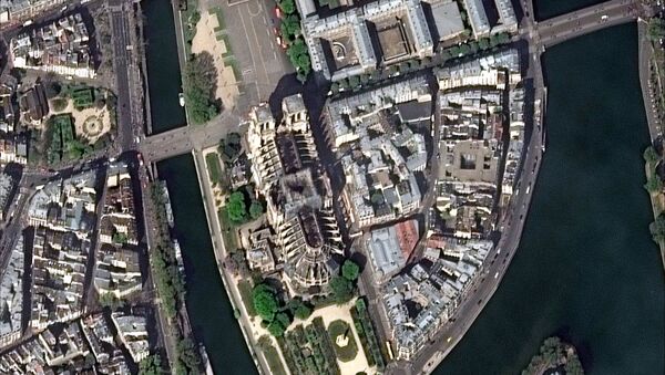 Notre Dame Cathedral is seen after a massive fire in this satellite image in Paris, France on April 17, 2019 - Sputnik International