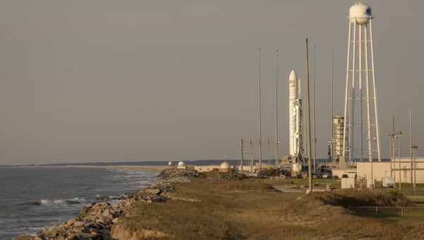 This photo provided by NASA shows the Northrop Grumman Antares rocket, with Cygnus resupply spacecraft onboard on Pad-0A, Wednesday, April 17, 2019 at NASA's Wallops Flight Facility in Virginia - Sputnik International