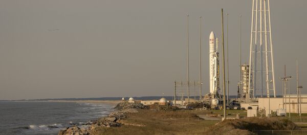 This photo provided by NASA shows the Northrop Grumman Antares rocket, with Cygnus resupply spacecraft onboard on Pad-0A, Wednesday, April 17, 2019 at NASA's Wallops Flight Facility in Virginia - Sputnik International