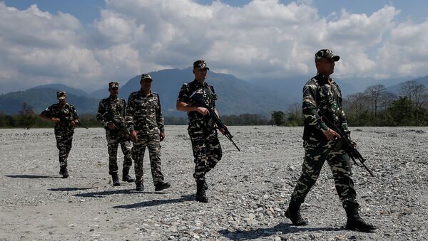Sashastra Seema Bal (SSB) troopers patrol near a polling station during the first phase of general election in Alipurduar district, in the eastern state of West Bengal, India, April 11, 2019 - Sputnik International