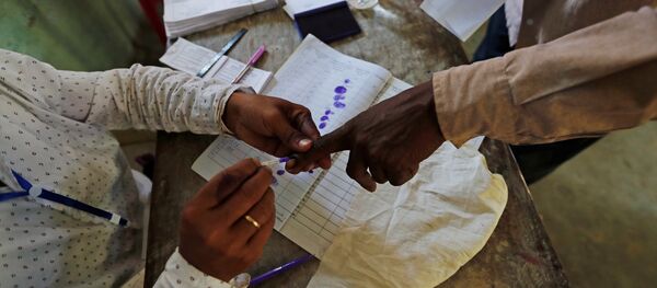 A man gets his finger inked before casting his vote at a polling station in Majuli, a large river island in the Brahmaputra river, in the northeastern Indian state of Assam, India April 11, 2019 A man gets his finger inked before casting his vote at a polling station in Majuli, a large river island in the Brahmaputra river, in the northeastern Indian state of Assam, India April 11, 2019 - Sputnik International