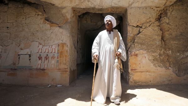 Chief excavation worker Aly Farouk stands outside a newly discovered pharaonic tomb Shedsu Djehuty in Luxor, Egypt April 18, 2019 - Sputnik International