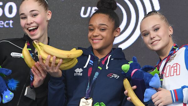 (L to R) Second placed Netherland's Eythora Thordsdottir, winner France's Melanie De Jesus Dos Santos and third placed Russia's Angelina Melnikova pose on the podium of floor exercises competition of the Artistic Gymnastics Championships in Szczecin, Poland on April 14, 2019 - Sputnik International