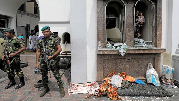 Sri Lankan military officials stand guard in front of the St. Anthony's Shrine, Kochchikade church after an explosion in Colombo, Sri Lanka April 21, 2019. - Sputnik International