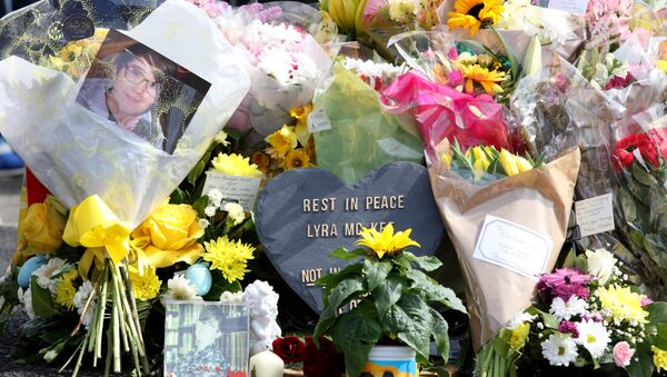 A picture shows the floral tributes placed at the scene in the Creggan area of Derry (Londonderry) in Northern Ireland on April 20, 2019 where journalist Lyra McKee was fatally shot amid rioting on April 18. - Sputnik International