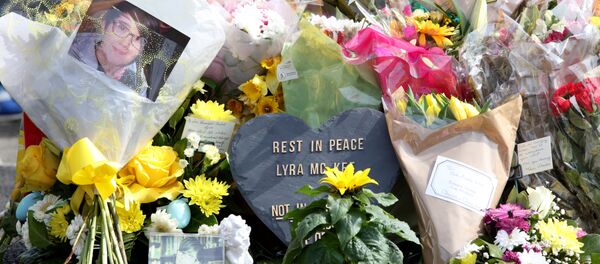 A picture shows the floral tributes placed at the scene in the Creggan area of Derry (Londonderry) in Northern Ireland on April 20, 2019 where journalist Lyra McKee was fatally shot amid rioting on April 18. - Sputnik International