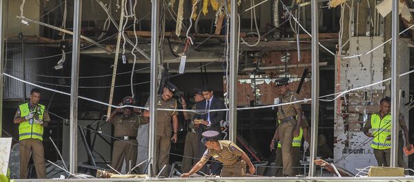 A Sri Lankan Police officer inspects a blast spot at the Shangri-la hotel in Colombo, Sri Lanka, Sunday, April 21, 2019. A Sri Lankan Police officer inspects a blast spot at the Shangri-la hotel in Colombo, Sri Lanka, Sunday, April 21, 2019. - Sputnik International