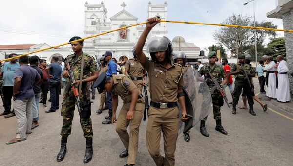Sri Lankan military officials stand guard in front of the St. Anthony's Shrine, Kochchikade church after an explosion in Colombo, Sri Lanka April 21, 2019 - Sputnik International