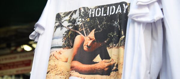 This photo taken on February 27, 2019, shows a t-shirt with a picture depicting a nude Adolf Hitler on a beach for sale at a street market for tourists in Bangkok - Sputnik International