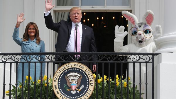 U.S. President Donald Trump and first lady Melania Trump wave beside a person in an Easter Bunny costume on the Truman balcony of the White House during the 2019 White House Easter Egg Roll in Washington, U.S., April 22, 2019 - Sputnik International