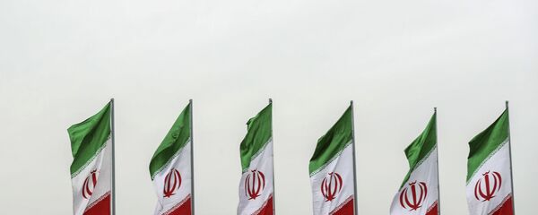 In this photo released by the official website of the office of the Iranian Presidency, a fighter jet flies over Iranian flags during the army parade commemorating National Army Day in front of the shrine of the late revolutionary founder Ayatollah Khomeini, just outside Tehran, Iran, Thursday, April 18, 2019 - Sputnik International
