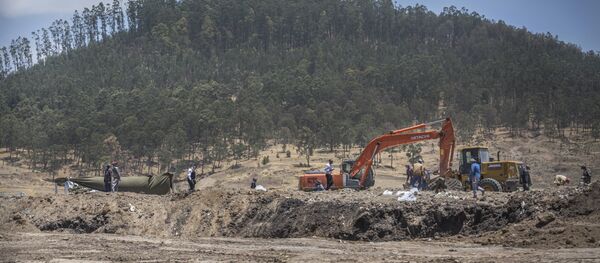 Recovery work continues at the scene where the Ethiopian Airlines Boeing 737 Max 8 crashed shortly after takeoff Recovery work continues at the scene where the Ethiopian Airlines Boeing 737 Max 8 crashed shortly after takeoff - Sputnik International