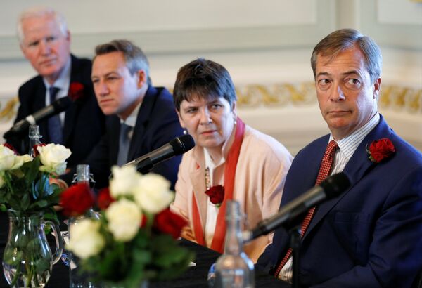 Brexit campaigner and Member of the European Parliament Nigel Farage, Claire Fox, James Glancy and Matthew Patten, candidates of Brexit party, look on during a news conference by the 'Brexit Party' campaign for the European elections, in London, Britain April 23, 2019 - Sputnik International