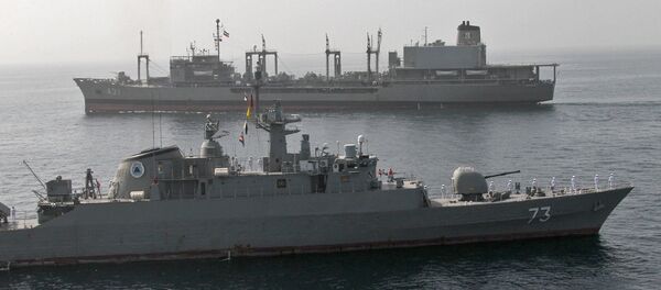 A handout photo made available by the Iranian Navy office on February 23, 2019, shows an Iranian Navy battleship sailing during a military drill in the Gulf of Oman, on February 22 - Sputnik International