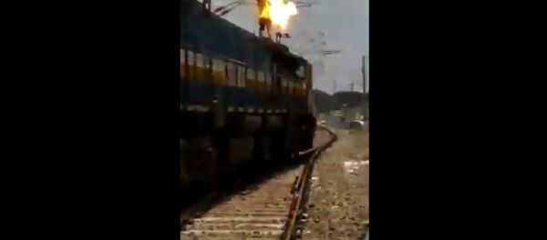 Man touches high voltage wire at railway station Man touches high voltage wire at railway station - Sputnik International