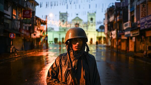 A Sri Lankan soldier stands guard under the rain at St. Anthony's Shrine in Colombo on April 25, 2019, following a series of bomb blasts targeting churches and luxury hotels on the Easter Sunday in Sri Lanka - Sputnik International