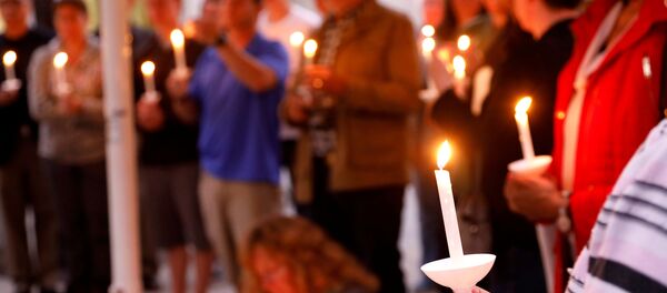 A candlelight vigil is held at Rancho Bernardo Community Presbyterian Church for victims of a shooting incident at the Congregation Chabad synagogue in Poway, north of San Diego, California, U.S. April 27, 2019 - Sputnik International