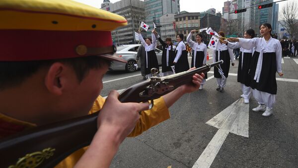 South Korean activists dressed as colonial-era Japanese soldiers reenact a crackdown of the independence movement during celebrations of the 98th Independence Movement Day in Seoul on March 1, 2017 - Sputnik International