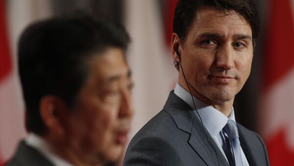 Japanese Prime Minister Shinzo Abe and Canadian Prime Minister Justin Trudeau answer questions during a joint media availability in Ottawa, Ontario, on April 28, 2019. - Sputnik International