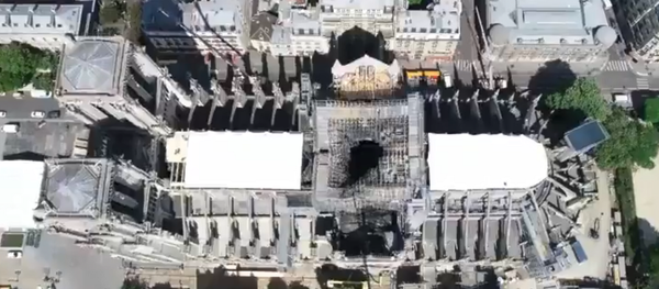 A drone video by Paris Prefecture de Police shows Notre Dame cathedral's roof secured following a massive fire two weeks prior - Sputnik International