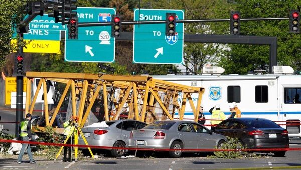 Emergency crews work at the scene of a construction crane collapse where several people were killed and others were injured Saturday, April 27, 2019, in the South Lake Union neighborhood of Seattle. The crane collapsed near the intersection of Mercer Street and Fairview Avenue pinning cars underneath it near Interstate 5. - Sputnik International