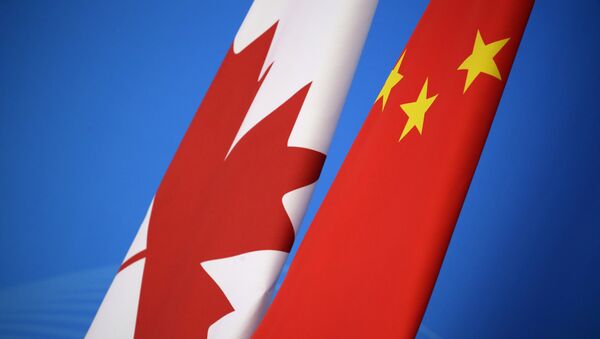 Flags of Canada and China are placed for the first China-Canada economic and financial strategy dialogue in Beijing, China, Monday, Nov. 12, 2018. - Sputnik International
