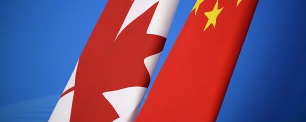 Flags of Canada and China are placed for the first China-Canada economic and financial strategy dialogue in Beijing, China, Monday, Nov. 12, 2018. - Sputnik International