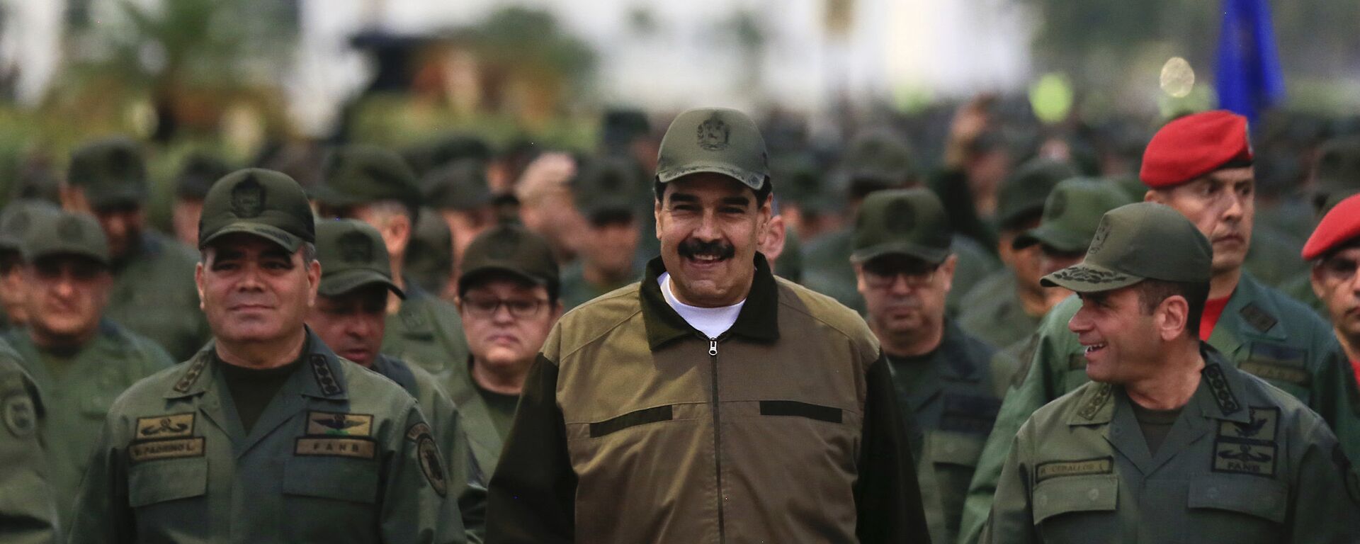 In this handout photo released by Miraflores Press Office, Venezuela's President Nicolas Maduro, center, accompanied by Defense Minister Gen. Vladimir Padrino Lopez, left, and the Strategies Operations Commander, Adm. Remigio Ceballos, arrive for a meeting with the troops at Fort Tiuna in Caracas, Venezuela, Thursday, May 2, 2019 - Sputnik International, 1920, 16.08.2023