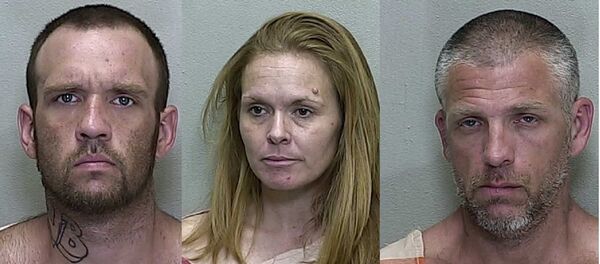 Brandon Hayley, Mary Durham and Lucian Evans appear in mugshots taken at the Marion County Jail in 2019. Brandon Hayley, Mary Durham and Lucian Evans appear in mugshots taken at the Marion County Jail in 2019. - Sputnik International