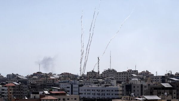 A picture taken from the Gaza Strip on May 4, 2019 shows missiles being launched toward Israel. A barrage of around 50 rockets was fired at Israel from the Gaza Strip on Saturday and dozens were intercepted by air defences, the Israeli army said. - Sputnik International