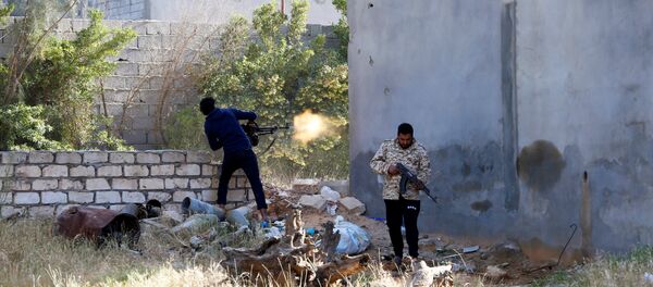A member of the Libyan internationally-recognized government forces fires during a fight with Eastern forces in Ain Zara, Tripoli, Libya April 28, 2019 A member of the Libyan internationally-recognized government forces fires during a fight with Eastern forces in Ain Zara, Tripoli, Libya April 28, 2019 - Sputnik International