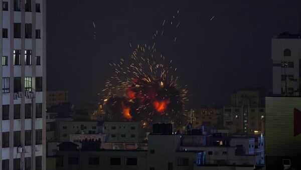 An explosion caused by an Israeli airstrike on a building in Gaza City, Saturday, May 4, 2019 - Sputnik International