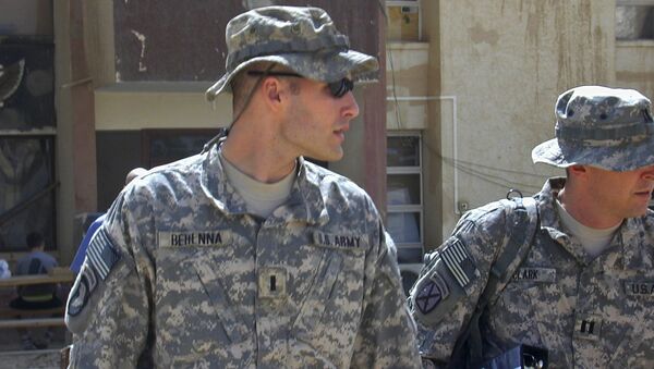 Sept. 21, 2008, file photo, 1st Lt. Michael C. Behenna, left, and his defense attorney Capt. Tom Clark, right, walk in Camp Speicher, a large U.S. base near Tikrit, north of Baghdad, Iraq - Sputnik International