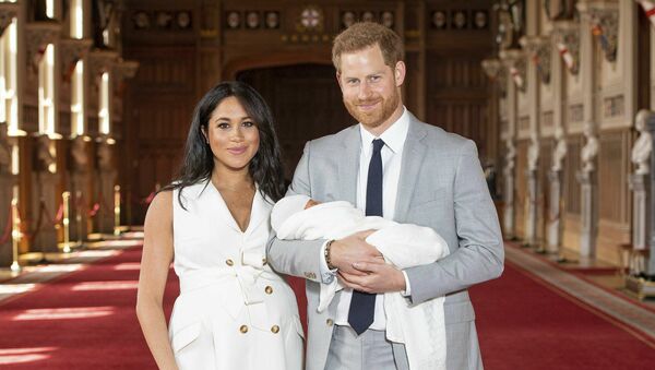 Britain's Prince Harry and Meghan, Duchess of Sussex, during a photocall with their newborn son, in St George's Hall at Windsor Castle, Windsor, south England, Wednesday May 8, 2019 - Sputnik International