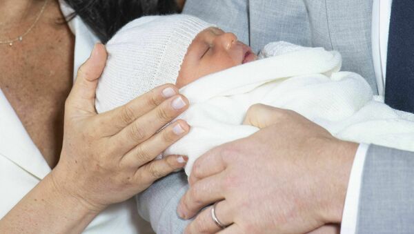 Britain's Prince Harry and Meghan, Duchess of Sussex, during a photocall with their newborn son, in St George's Hall at Windsor Castle, Windsor, south England, Wednesday May 8, 2019. Baby Sussex was born Monday at 5:26 a.m. (0426 GMT; 12:26 a.m. EDT) at an as-yet-undisclosed location. - Sputnik International