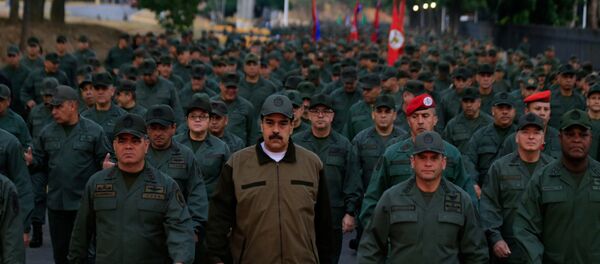 Venezuela's President Nicolas Maduro walks next to Venezuela's Defense Minister Vladimir Padrino Lopez and Remigio Ceballos, Strategic Operational Commander of the Bolivarian National Armed Forces - Sputnik International