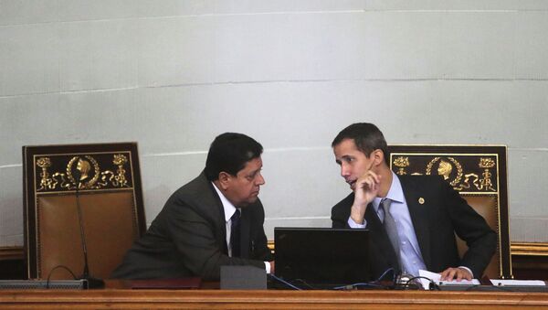 Venezuelan opposition leader Juan Guaido, who many nations have recognised as the country's rightful interim ruler, talks to Edgar Zambrano, the assembly vice president, in a session of the National Assembly in Caracas, Venezuela March 6, 2019. Picture taken March 6, 2019. REUTERS/Ivan Alvarado - Sputnik International