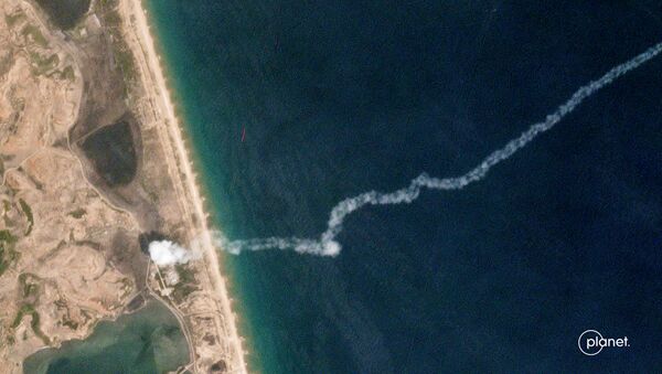 The trail of a suspected missile is seen on a commercial satellite image captured by Planet over the Hodo Peninsula in North Korea - Sputnik International