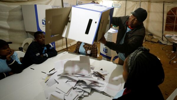 FILE PHOTO: An election official empties a ballot box as counting begins after polls closed in Alexandra township in Johannesburg, South Africa, May 8,2019. REUTERS/Mike Hutchings - Sputnik International