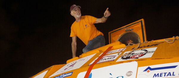 Frenchman Jean-Jacques Savin, who floated across the Atlantic in a custom-made barrel for nearly 100 days, stands on his barrel aboard the ship Friendship after being brought back to land in Fort-de-France, on the French Caribbean island of Martinique, on May 9, 2019. - Sputnik International