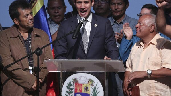 Venezuela's opposition leader and self proclaimed interim President Juan Guaido, center, speaks during a meeting with oil workers at the Metropolitan University of Caracas, Venezuela, Friday, May 3, 2019 - Sputnik International