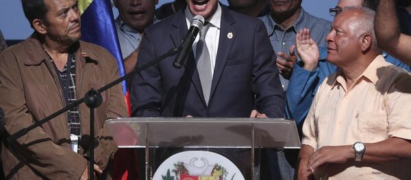 Venezuela's opposition leader and self proclaimed interim President Juan Guaido, center, speaks during a meeting with oil workers at the Metropolitan University of Caracas, Venezuela, Friday, May 3, 2019 - Sputnik International
