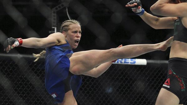 Katlyn Chookagian kicks Irene Aldana during a mixed martial arts bout at UFC 210, Saturday, April 8, 2017, in Buffalo, N.Y. - Sputnik International